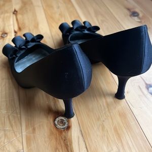 Stuart Weitzman black satin ruffle front pumps